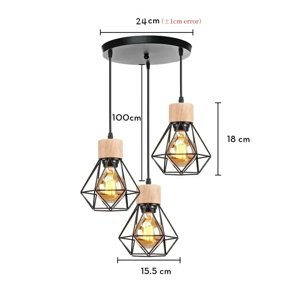 Set of three black iron cage pendant lights with wooden caps and warm filament bulbs for dining room lighting