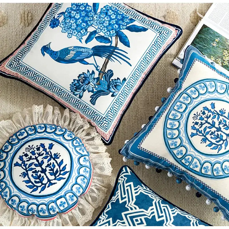 Vintage blue and cream peacock toile ceramic pillow cover with intricate floral and bird designs and geometric border cushion case