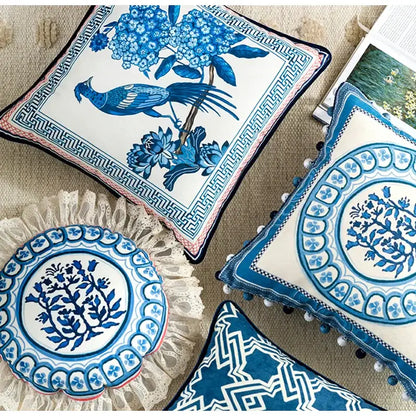 Vintage blue and cream peacock toile ceramic pillow cover with intricate floral and bird designs and geometric border cushion case