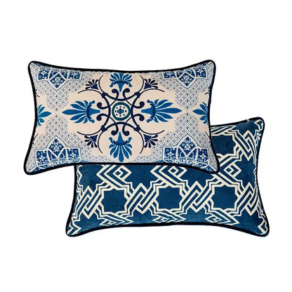 Two rectangular throw pillows with vintage blue and cream peacock toile pillow cover and navy cushion case designs