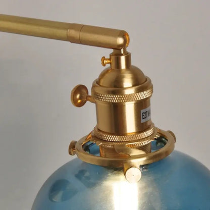 Brass-finished wall lamp with blue glass globe base vintage decorbites blue glass bedroom pull chain sconce