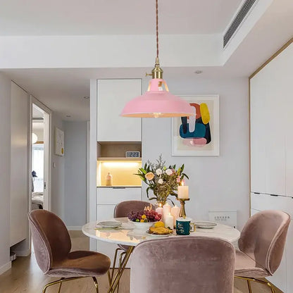 Pink pendant light with brass hardware above dining table complementing decorbites blue iron art pendant light