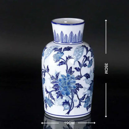 Vintage blue and white porcelain ceramic vase with intricate floral patterns and fluted rim for home decor
