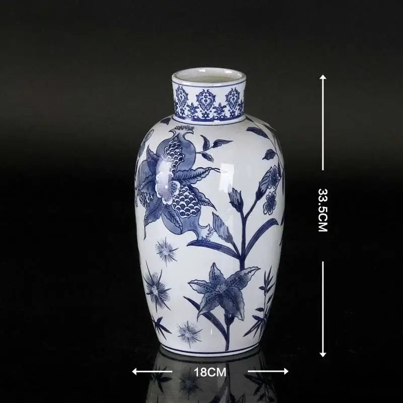 Vintage blue and white porcelain ceramic vase with intricate floral and bird motifs glossy finish for home decor