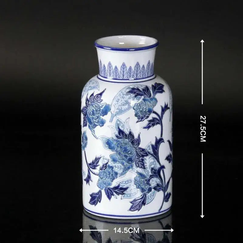Vintage porcelain ceramic vase in blue and white with intricate floral patterns and a fluted rim for home decor