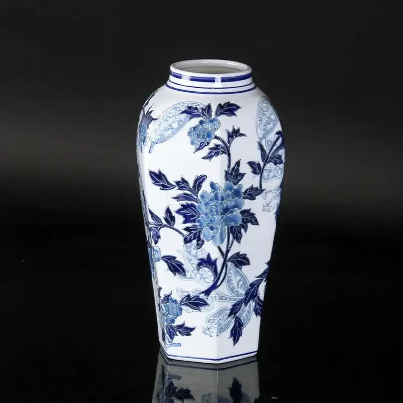 Vintage blue and white porcelain ceramic vase with intricate peony patterns and hexagonal shape for home decor