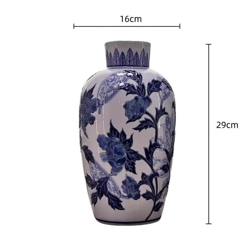 Vintage blue and white porcelain ceramic vase with intricate cobalt floral patterns for elegant home decor