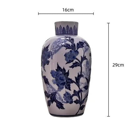Vintage blue and white porcelain ceramic vase with intricate cobalt floral patterns for elegant home decor