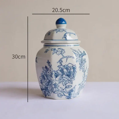 A vintage blue white porcelain vase ceramic jar with blue floral and bird patterns and a matching lid for living room decor
