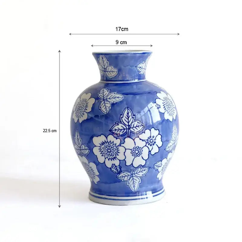 A vintage blue white porcelain vase decorated with delicate floral patterns for living room decorbites blue white use