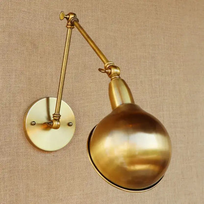 Vintage brass adjustable long arm wall light with a spherical polished finish for bedroom decorbites adjustable long use