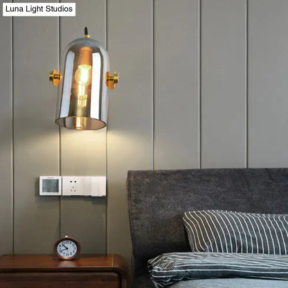 Vintage brass amber and smoke glass cloche bedside sconce with chrome-finished swivel shade cloche and incandescent bulb