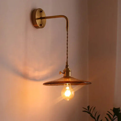 Vintage brass wall sconce with amber glass copper led shade and twisted cord for bedroom light fixture