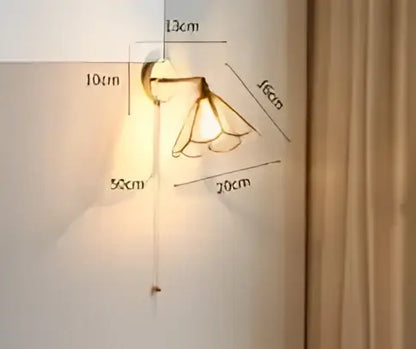 Vintage brass led wall lamp with amber glass shades mounted on metal bracket for bedroom sconce lighting