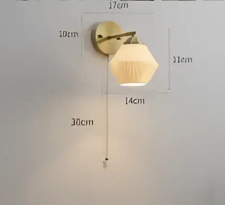 Vintage brass and amber glass led wall lamp featuring a frosted glass shade for bedroom sconce lighting