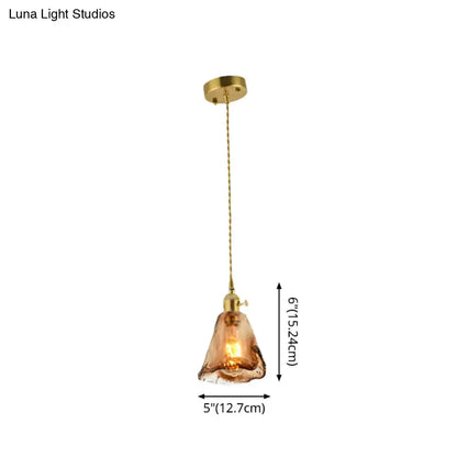 DecorBites brass shaded drop pendant light with warm amber tan glass and brass-finished metal fixture for living room