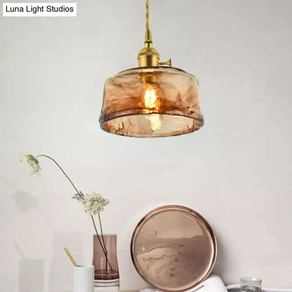 DecorBites™ brass shaded drop pendant light with warm amber tan glass and twisted cord for living room use