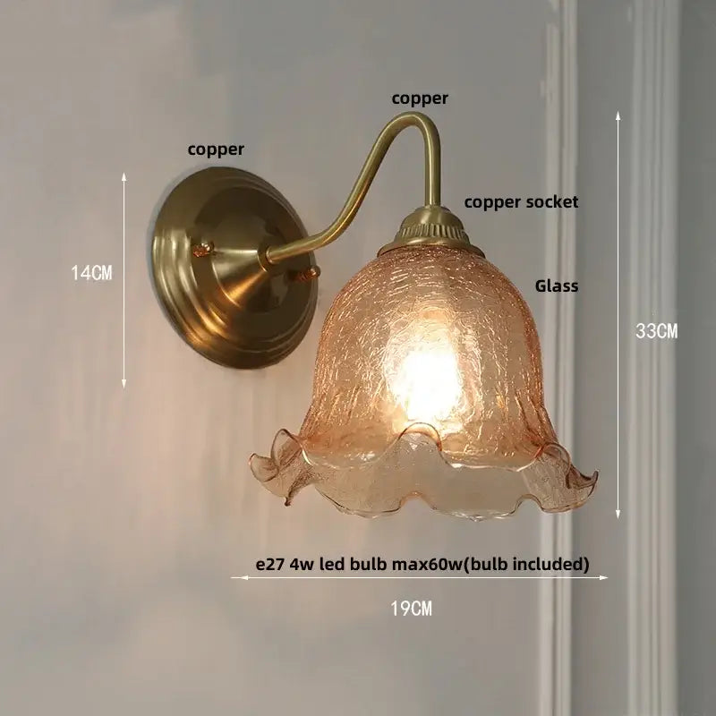 Vintage brass and copper-finished wall sconce with decorbites amber glass ruffled shade for bedroom vanity light