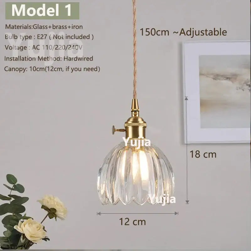 Vintage brass pendant light with clear fluted glass shade and polished copper hardware, ideal for kitchen lighting