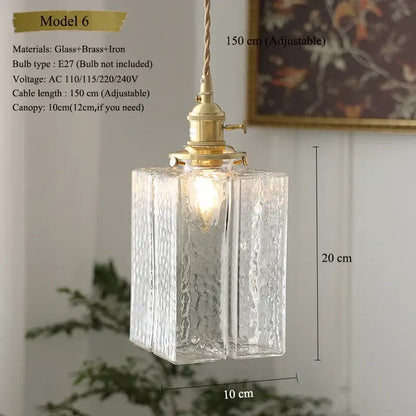 Model 6 pendant light features clear textured glass with brass and iron hardware in a vintage floral kitchen shade