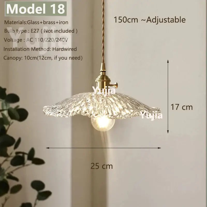 Vintage brass pendant light with clear glass textured shade and brass-finished metal components for kitchen lighting