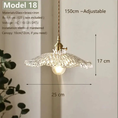 Vintage brass pendant light with clear glass textured shade and brass-finished metal components for kitchen lighting