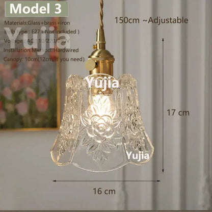 Vintage brass pendant light with clear glass floral shade and polished copper hardware for kitchen lighting