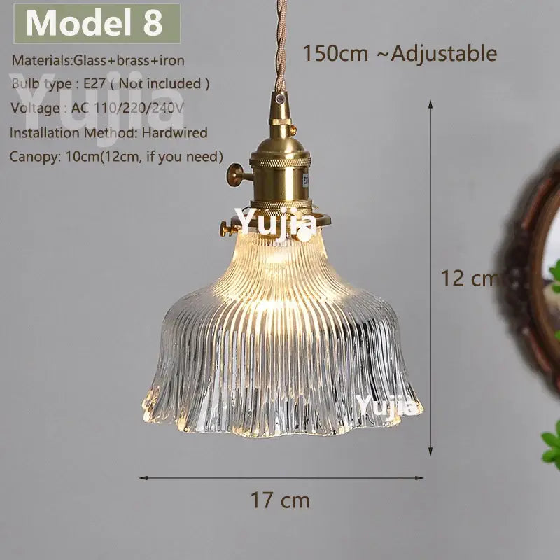 Vintage brass pendant light with clear ribbed glass shade and polished copper hardware for kitchen use