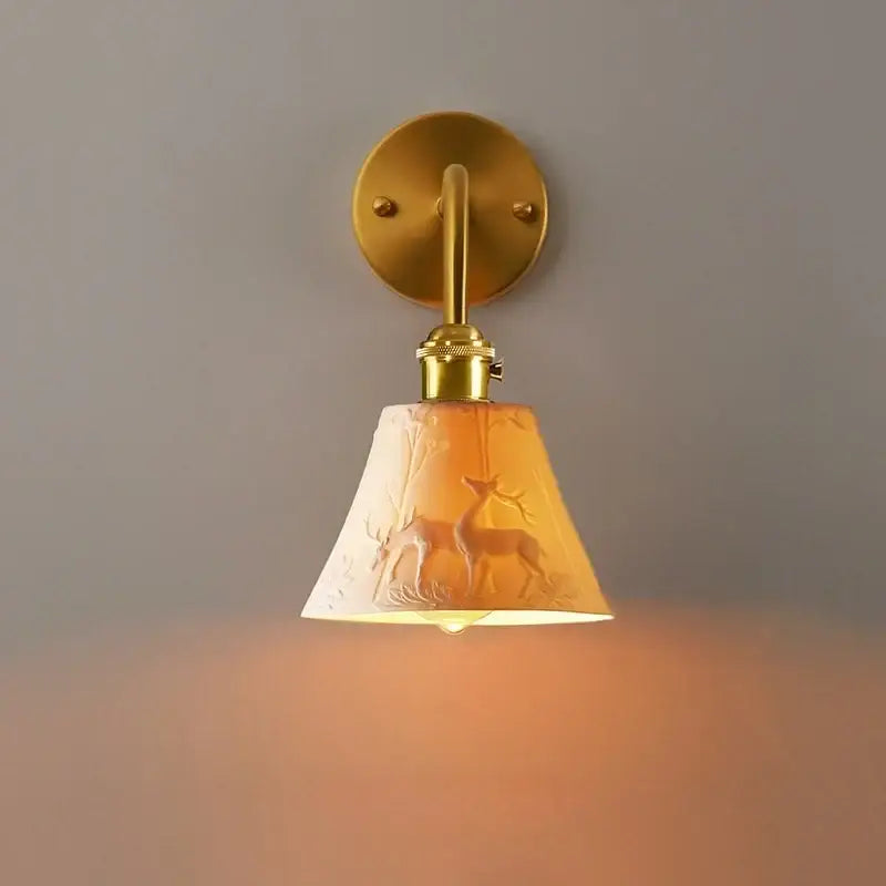 Vintage brass and frosted glass wall sconce with amber shade featuring embossed deer silhouettes decorbites ceramic led wall