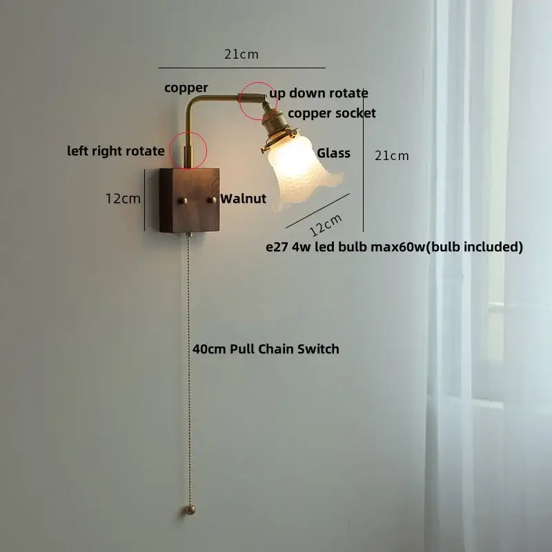 Copper-finished wall lamp with walnut base and glass pink led lampshade featuring pull chain switch for bedroom sconce