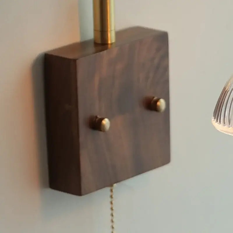Dark wood wall lamp base with brass accents and two round knobs for vintage glass pink led bedroom sconce