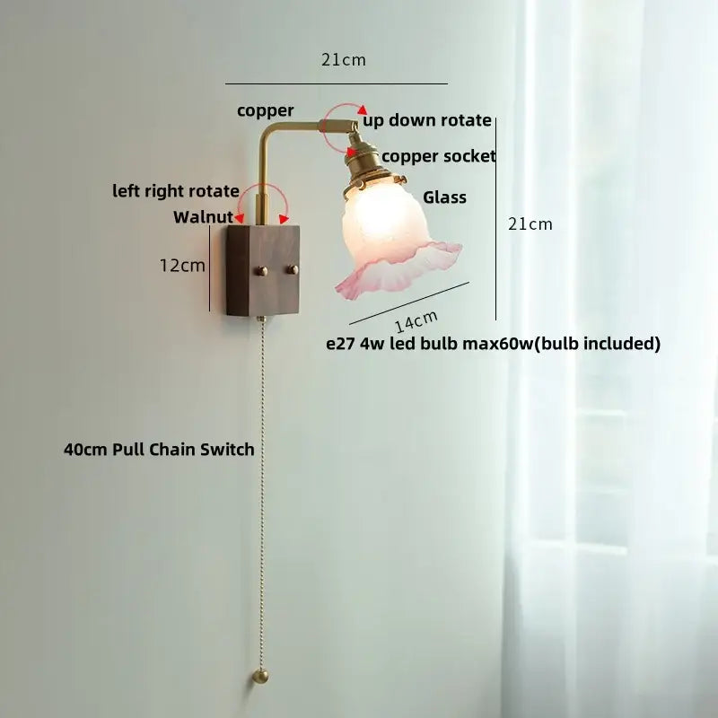 Vintage brass and glass pink led wall sconce with copper finish, frosted glass shade, and walnut-mounted base for bedroom