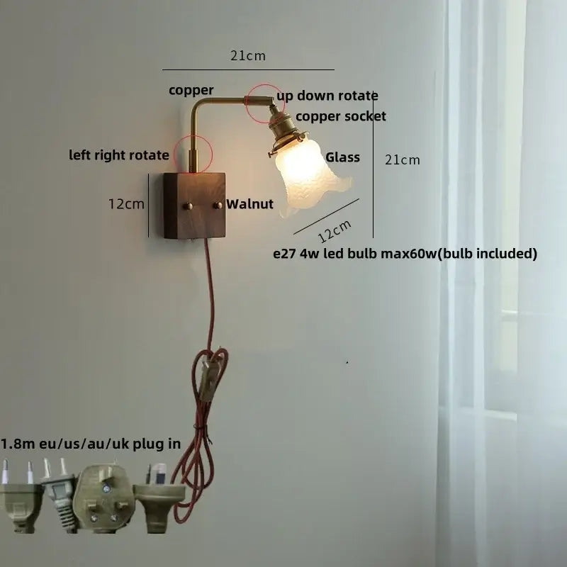 Copper wall sconce with walnut-finished base, adjustable arm, and glass pink led shade for bedroom bedside lighting