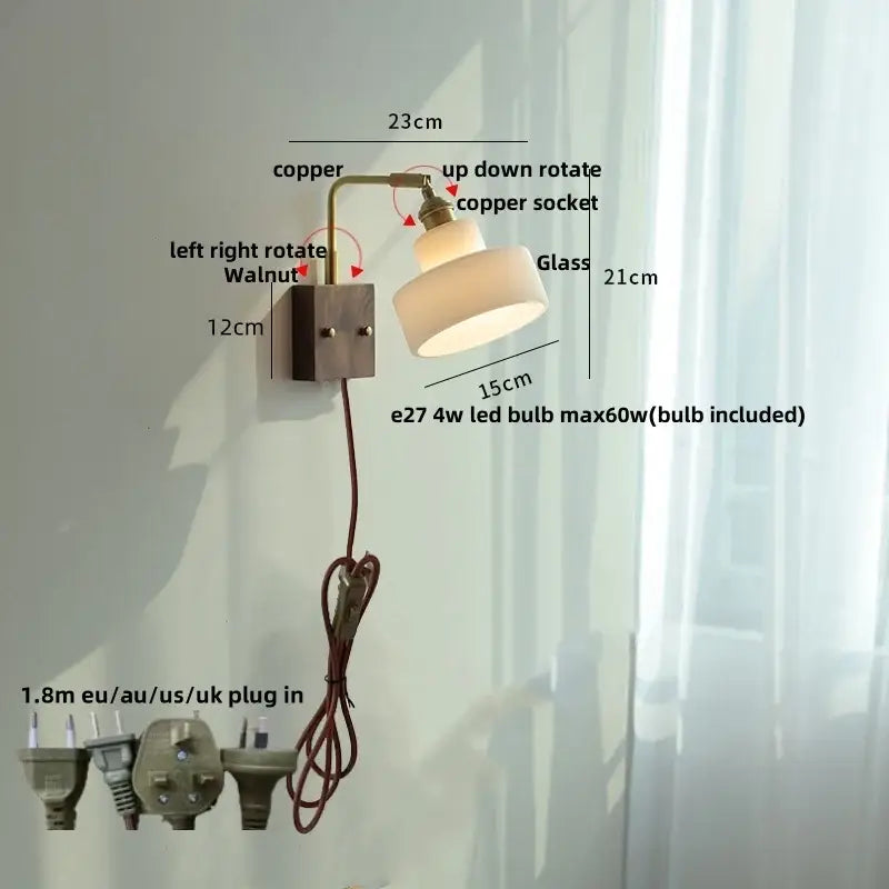 Vintage brass and glass pink led wall sconce with copper arm, off-white shade, and dark walnut base for bedroom bedside use