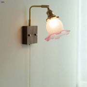 Vintage brass and glass pink led wall sconce with translucent ruffled shade for bedroom bedside lighting