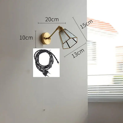 Brass-finished wall lights with green glass led faceted shade and articulated arm for vintage bedroom sconce lighting