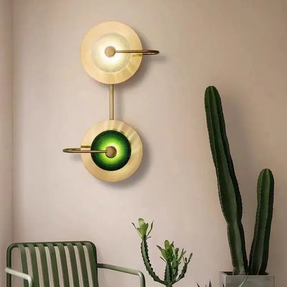 Modern vintage brass wall lamp with green glass metal wall art light featuring two circular glowing shades