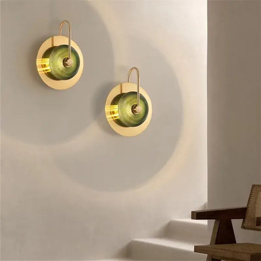 Two elegant vintage brass wall lamps with textured green glass shades for metal wall art light in living room decor