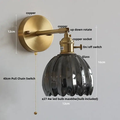 Vintage brass wall light with decorbites amber glass ribbed shade and brushed copper finish for bedroom pull chain