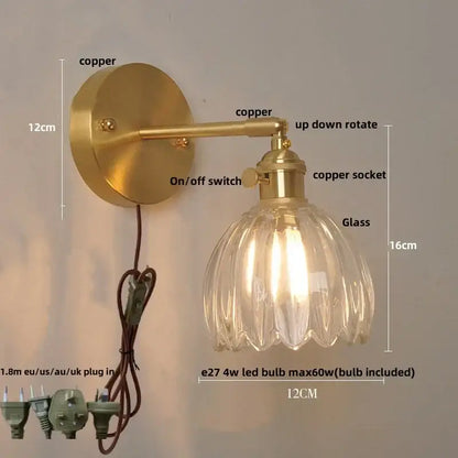 Vintage brass wall light with decorbites amber glass and fluted shade featuring a bedroom pull chain design