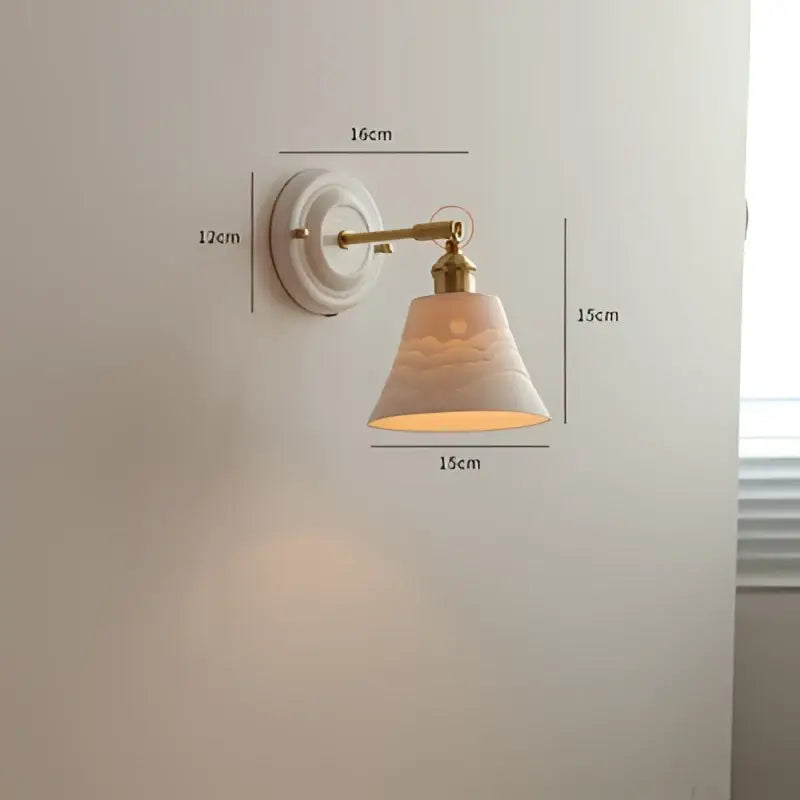 White ceramic wall light with brass arm and decorative cloud motif shade for vintage led wall bedroom sconce
