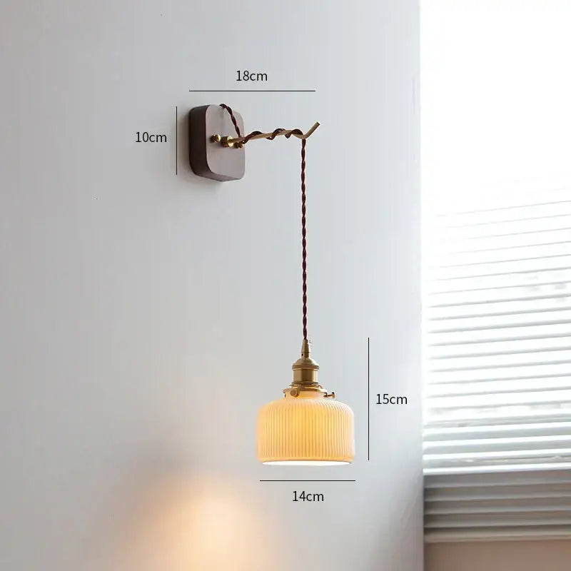 Vintage brass and ribbed glass led wall sconce with warm tones and twisted cord for decorbites led wall lighting