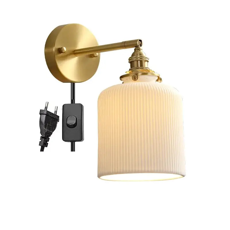 Vintage brass led wall lamp with scalloped ribbed off-white glass shade ideal for bedroom lighting