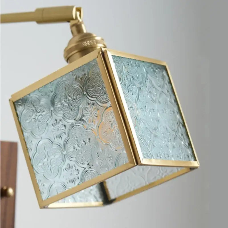 Vintage brass and walnut cube wall light with frosted floral glass panels and pull chain switch for bedroom use