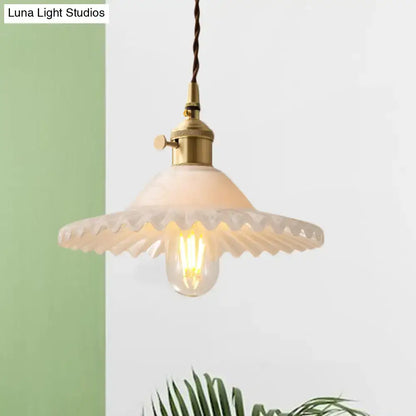 Vintage-style DecorBites™ Chloe scalloped pendant light with brass metal fixture and off-white glass shade