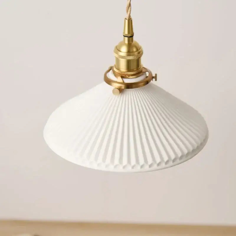 Vintage brass pendant light with white pleated ceramic shade and polished copper fixture for dining room lighting