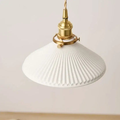 Vintage brass pendant light with white pleated ceramic shade and polished copper fixture for dining room lighting