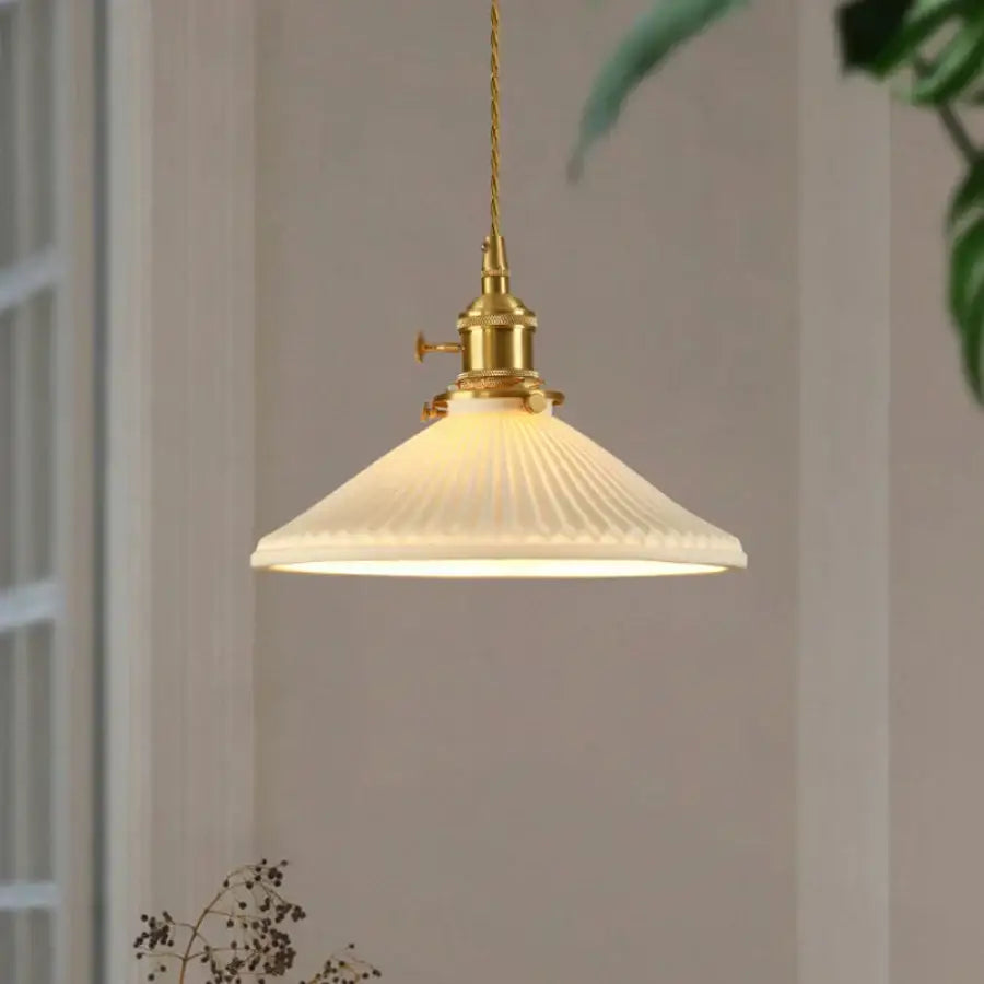 Vintage brass pendant light with off-white ribbed glass white shade and polished copper fixture for dining room use