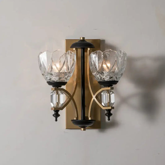 Vintage brass and black two-light wall sconce with crystal bowl-shaped shades and gold finish for 220v-240v use