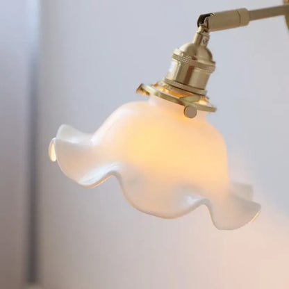 Vintage brass ceramic led wall light featuring a delicate white ruffled glass shade for bedroom decorbites ceramic led wall use